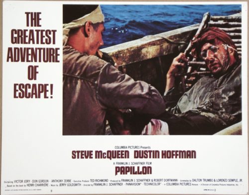 Original vintage US cinema Lobby Card for 1973 hit movie, Papillon, starring Steve McQueen and Dustin Hoffman, measuring 11 ins by 14 ins