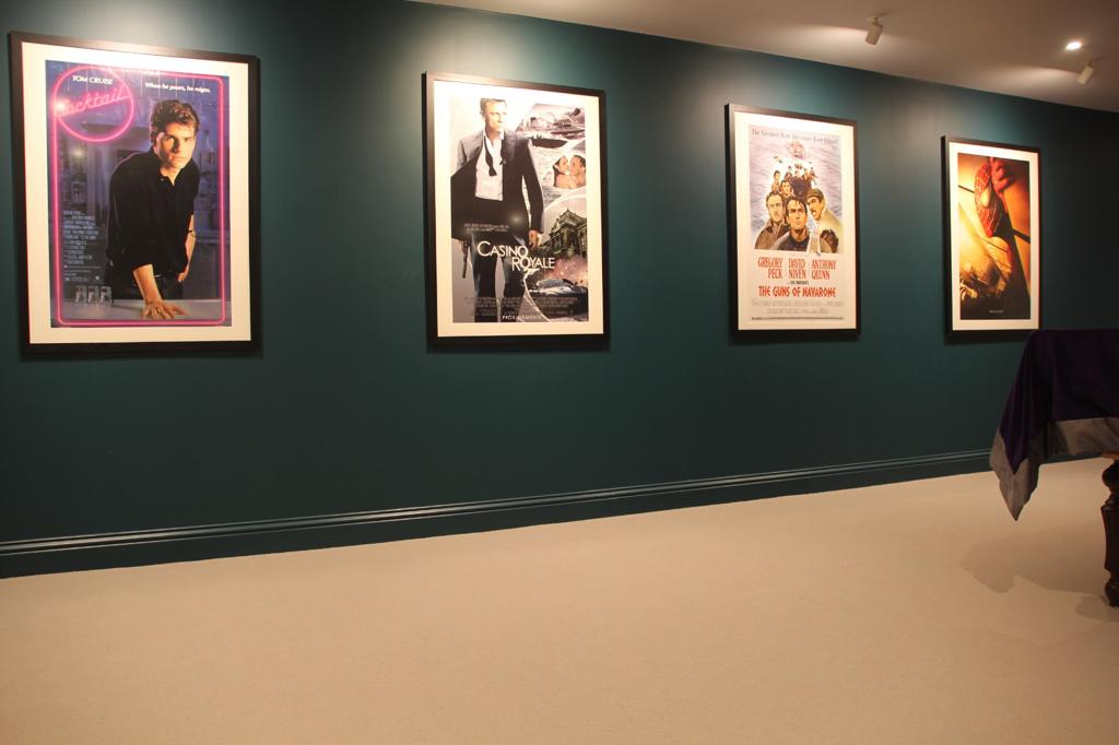 A home cinema decorated with vintage original movie posters