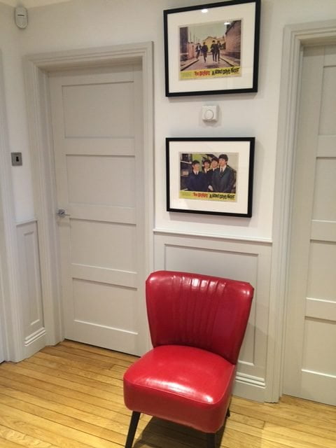 Nintage original lobby cards decorating a small space