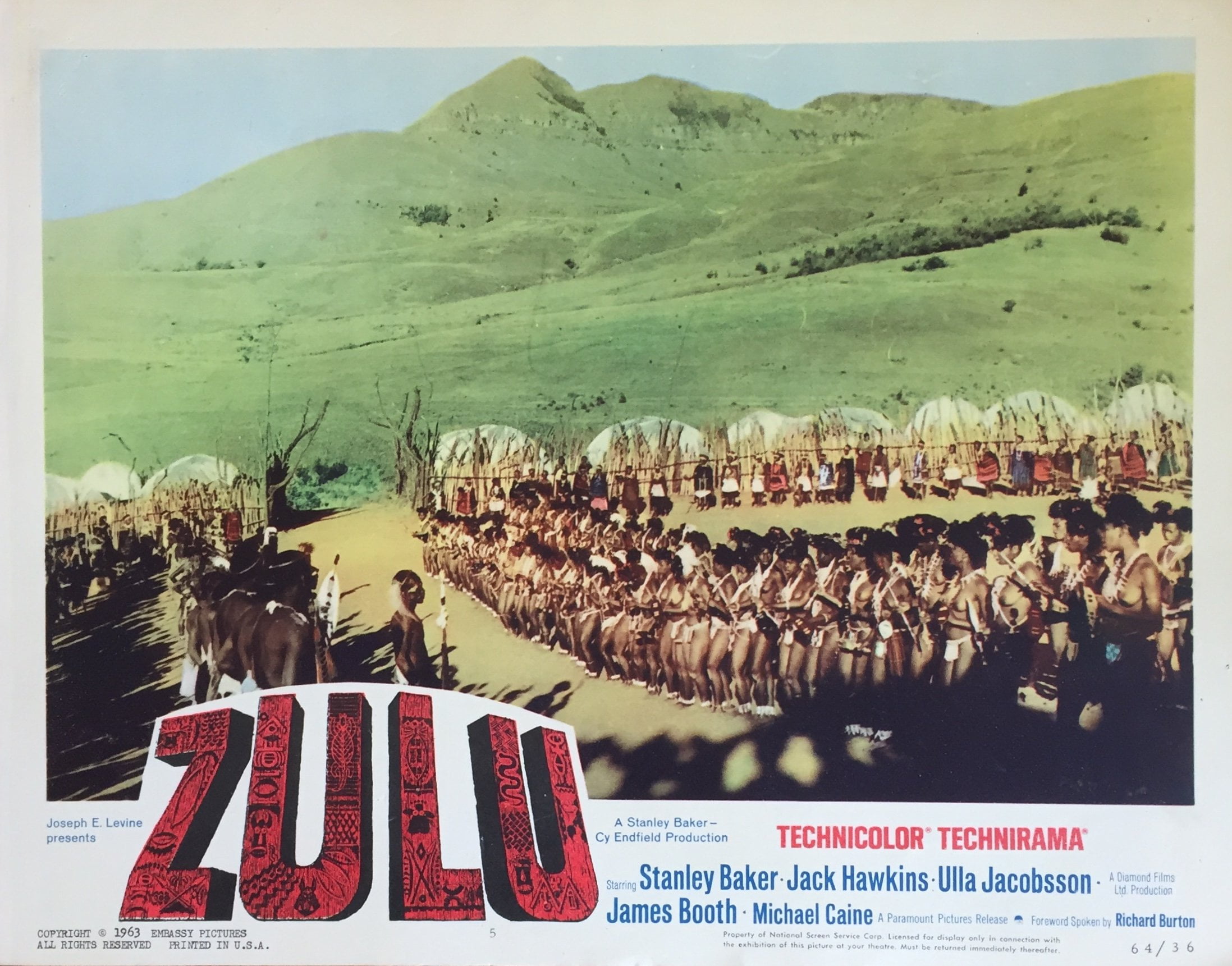 Original vintage US cinema lobby card poster for classic war movie Zulu starring Michael Caine